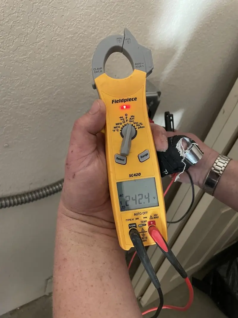 Voltage testing with clamp meter during Hot Tub / Pool Electrical Wiring in Clyde